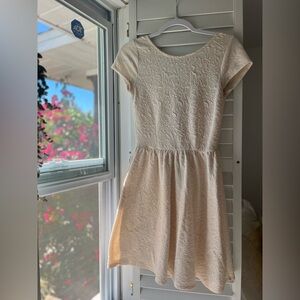 Cream colored sundress with open back and zipper